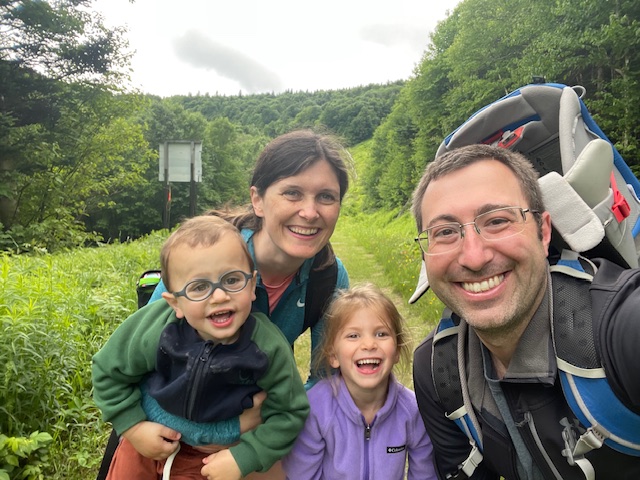 Jenna and Steve with their two kids hiking
